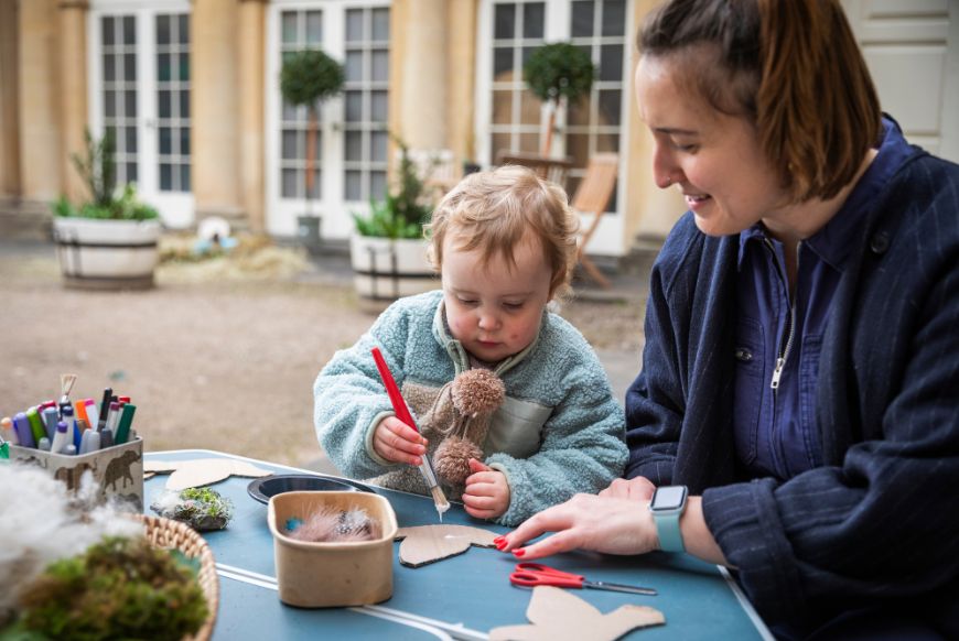 Childrens nature craft activities during the Climate Hub on the courtyard of Bath Assembly Rooms Somerset